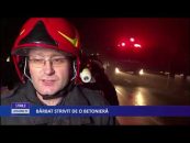 BĂRBAT STRIVIT DE O BETONIERĂ